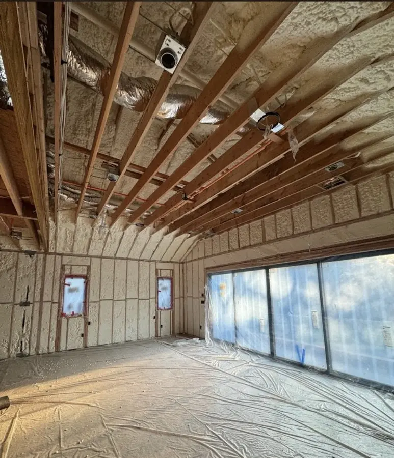 Interior walls and ceiling insulated with spray foam during new construction in Wildwood